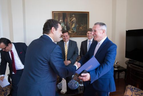 Elder Soares greeting political leader in Costa Rica