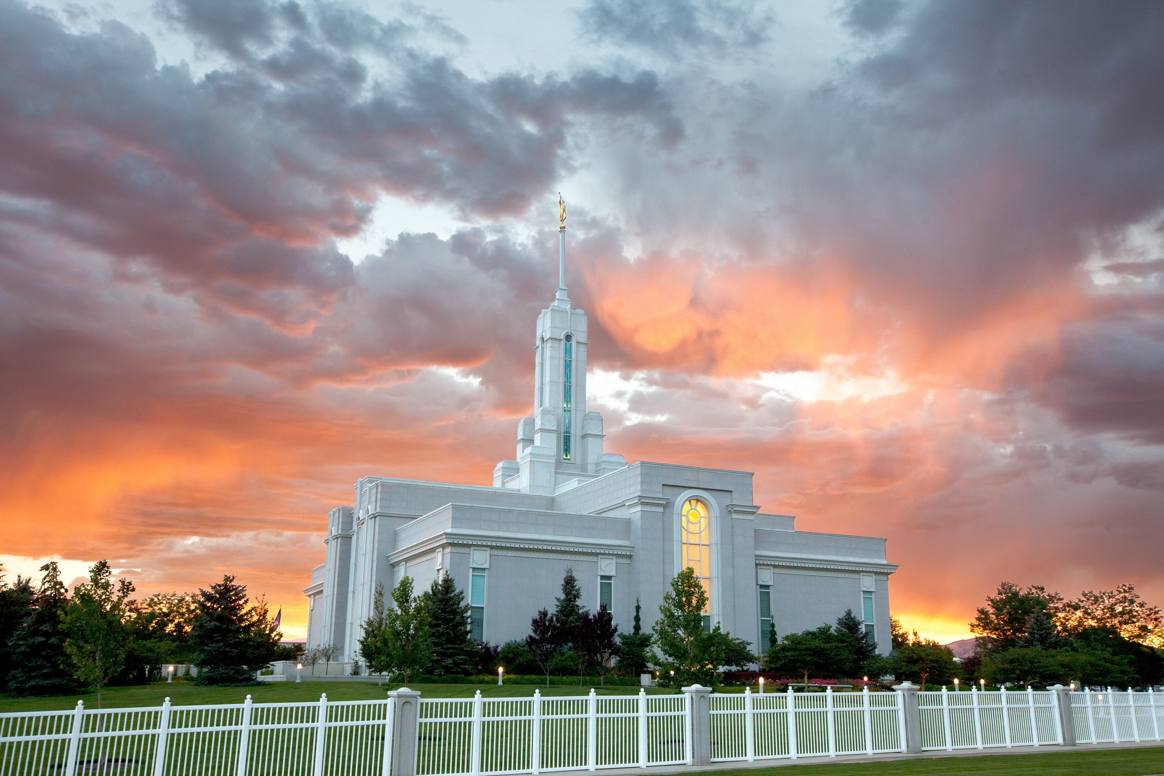 The Mount Timpanogos Utah Temple at sunset, including the grounds.