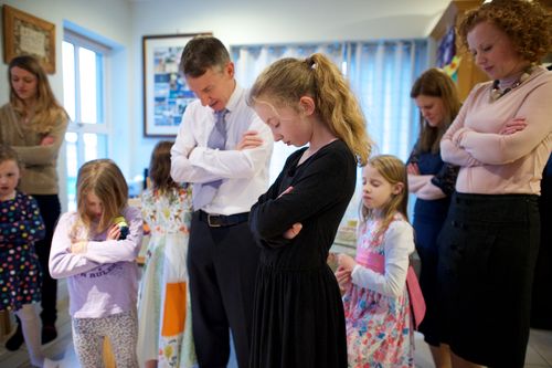 a family praying together