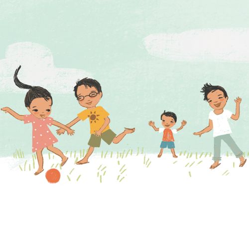 children kicking a ball outside