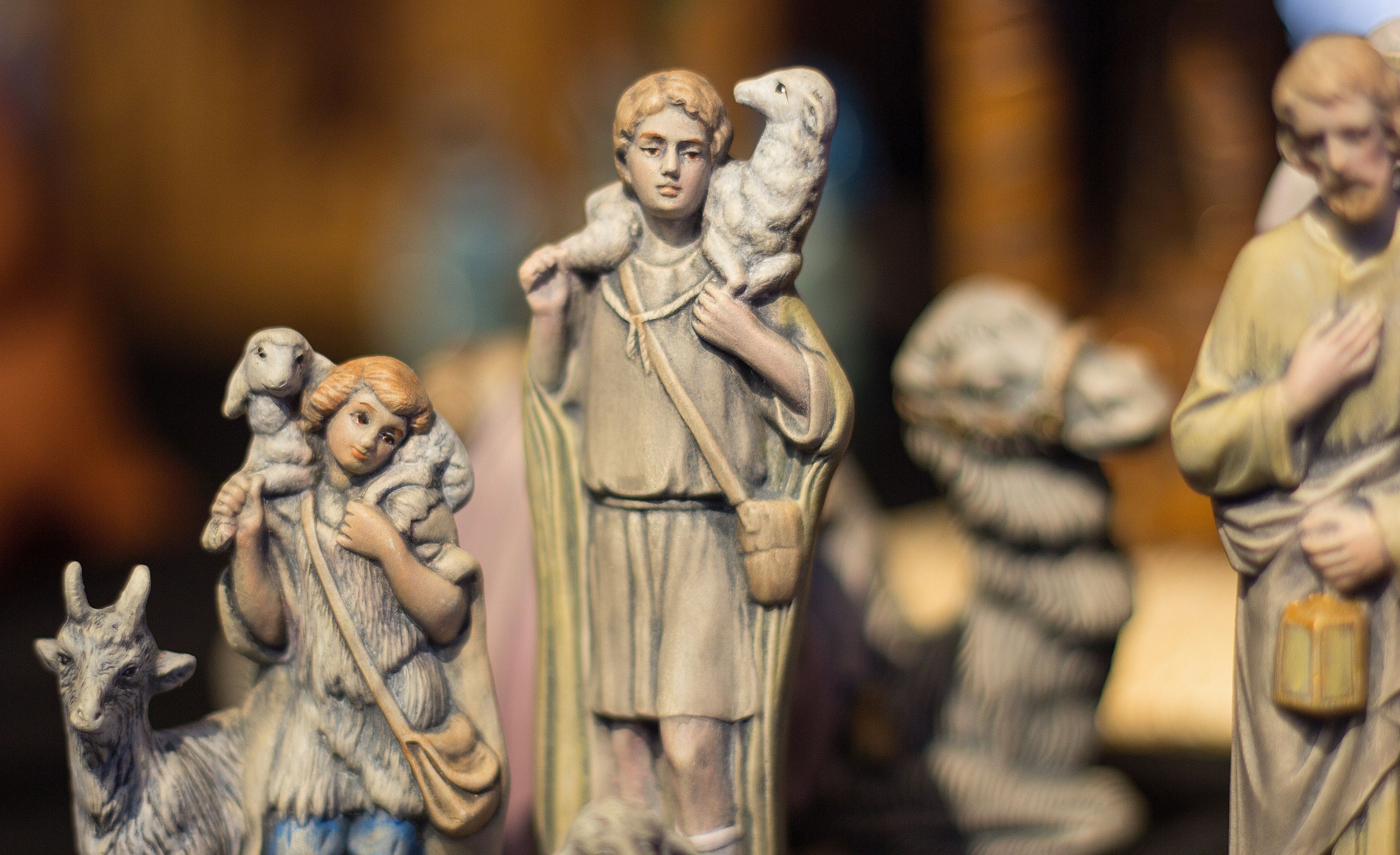 Several shepherd figurines from a Nativity set.