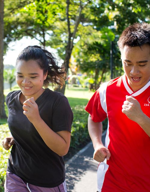 woman and man running together