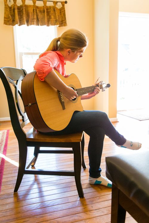 woman playing guitar