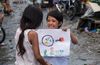 boy showing a drawing to a girl