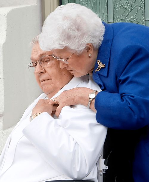 President Packer and his wife holding hands