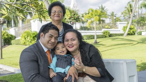 multi-generational family at temple