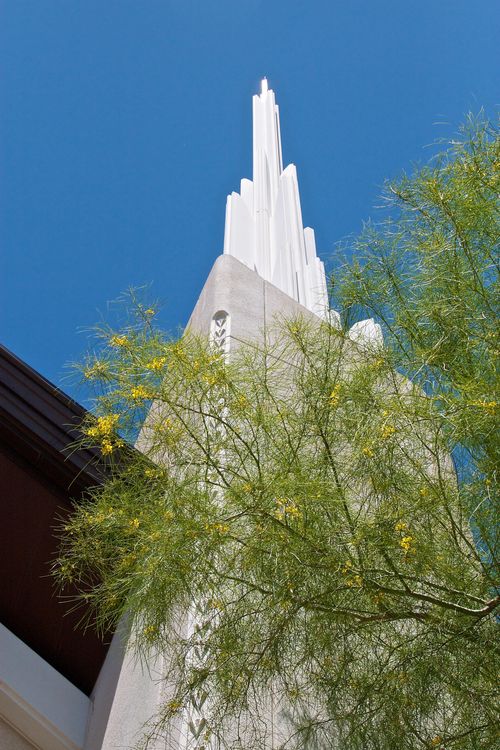 A view of one of the spires on the Las Vegas Nevada Temple from below, looking up toward a blue, cloudless sky.