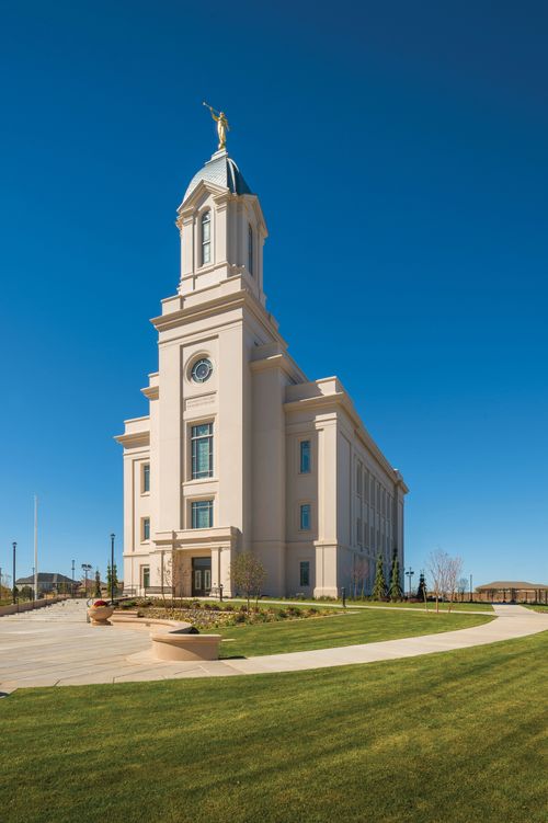 The exterior of the Cedar City Utah Temple against a blue sky.