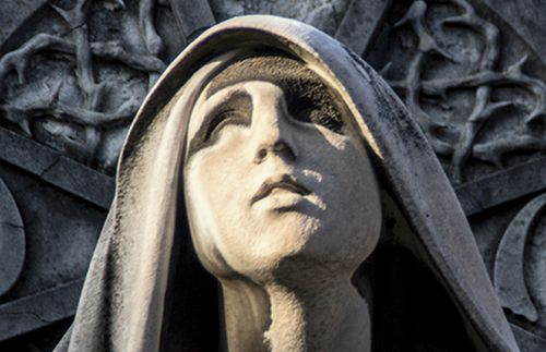 statue of woman looking upward