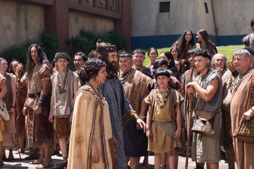 King Mosiah and his wife walk through a crowd of the people of Zarahemla before speaking to them concerning the records of the people of Zeniff.