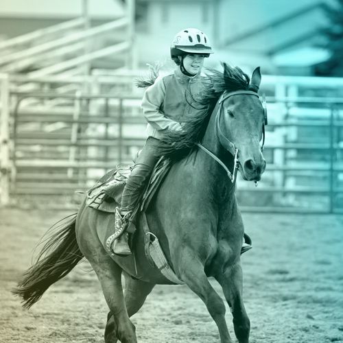 young woman riding horse