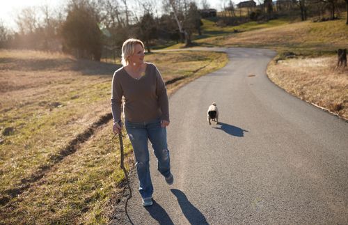 Shelly walking with her dog