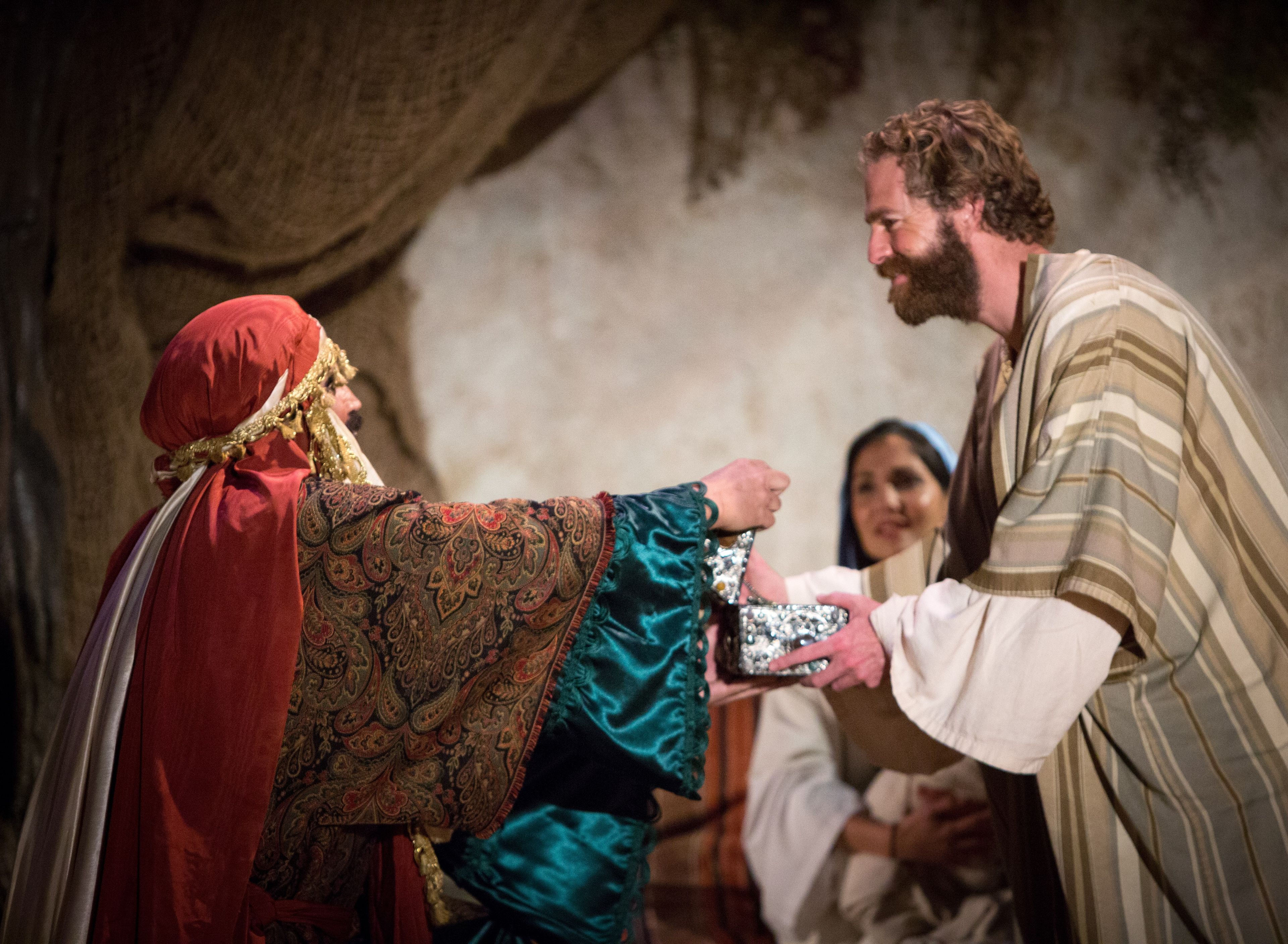 One of the Wise Men handing Joseph a gift in the Arizona Christmas pageant.