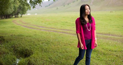 young woman by a path