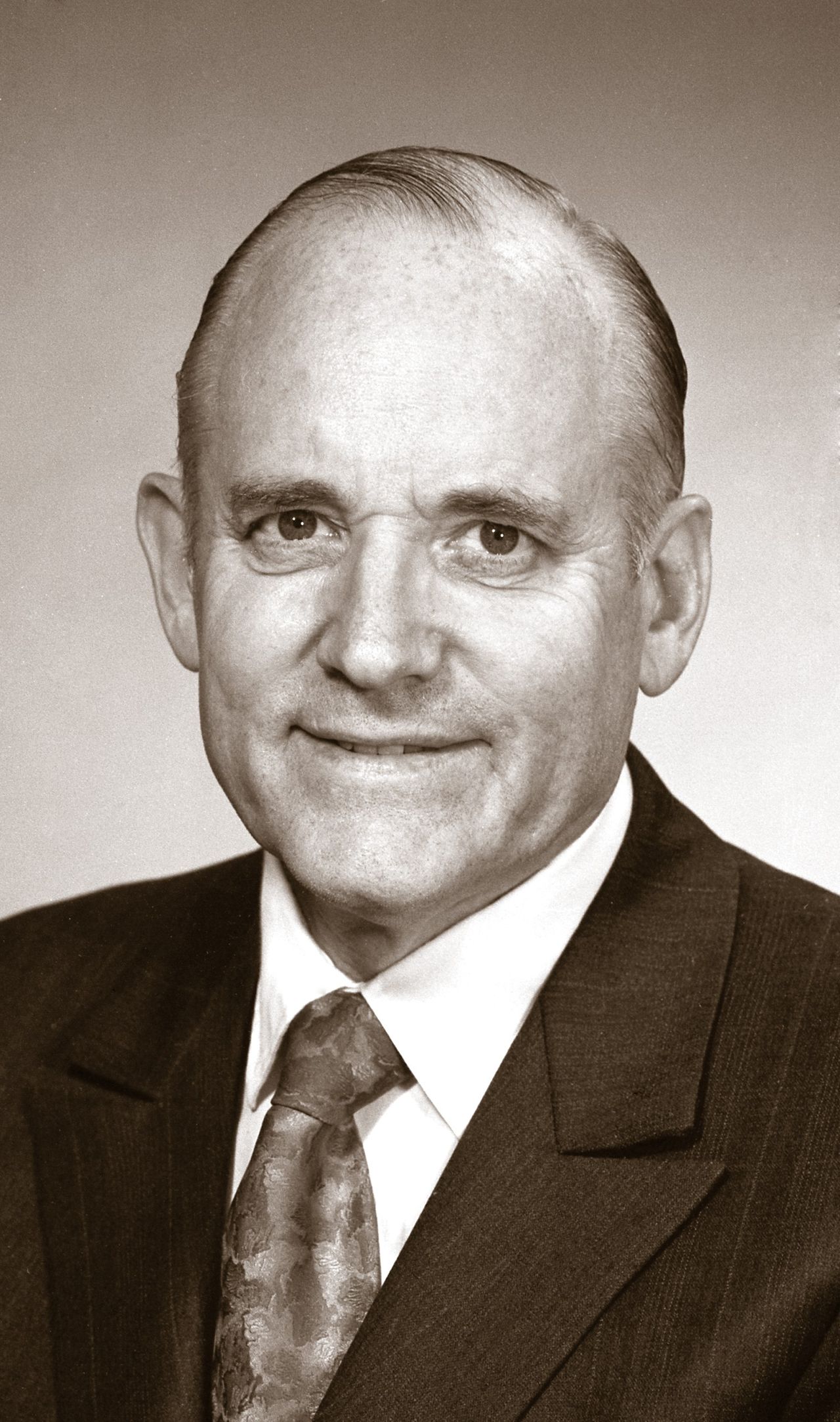 A black-and-white portrait of President Howard W. Hunter.