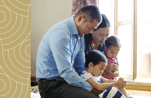 family praying together