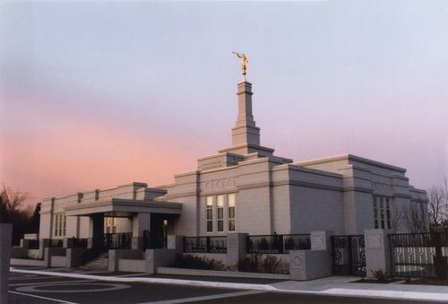 The Edmonton Alberta Temple just after sunset, with the sky fading from blue to pink in the background.