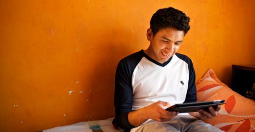 young man using tablet