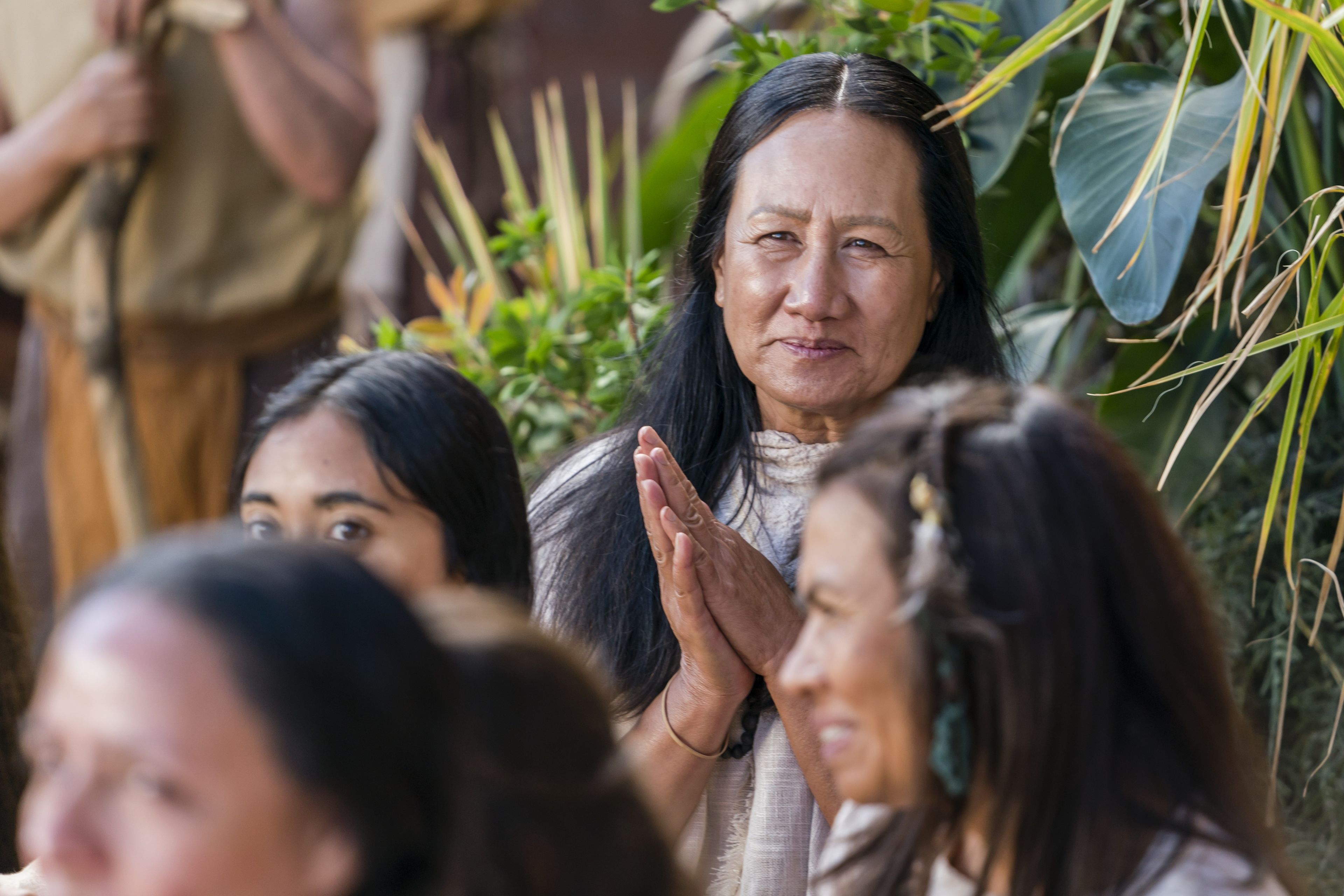 A woman listens as Alma the Younger preaches to the people of Gideon.