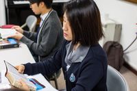 youth studying the scriptures in class