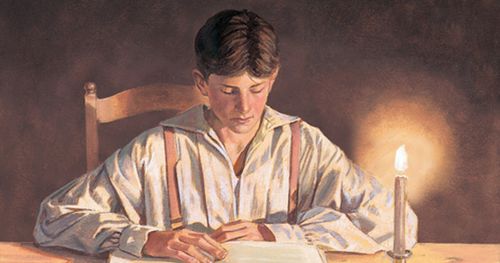 Joseph Smith reading the Bible by candlelight.