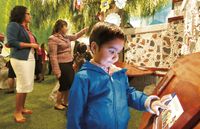 boy using touch screen at visitors’ center