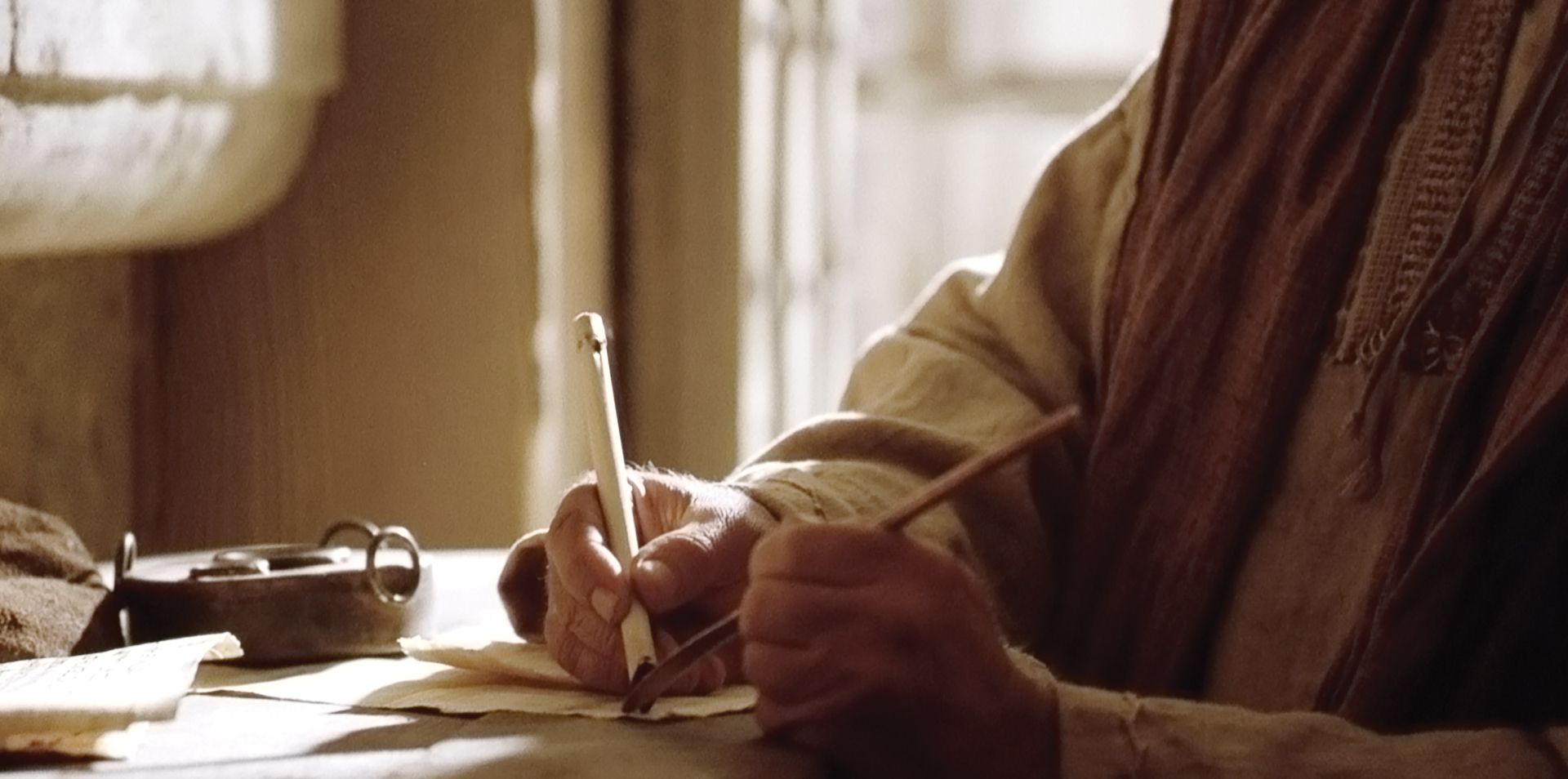 A scribe writes down the words of Paul.