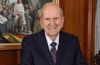 President Nelson in front of painting of Savior