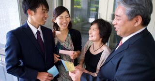 couples holding cards to do temple work