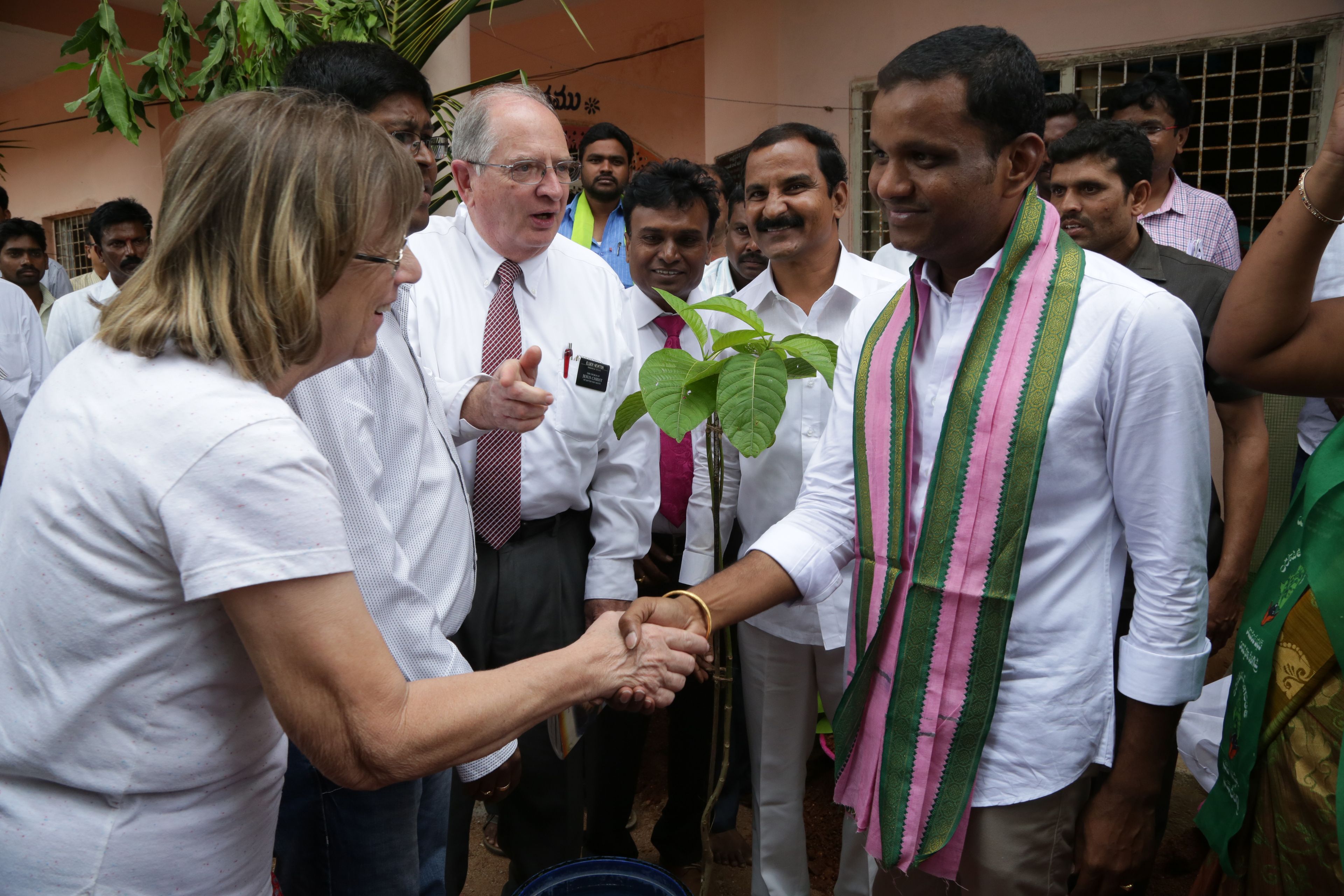 Humanitarian service missionaries meet with a group of people in India as part of the LDS Charities clean water initiative.