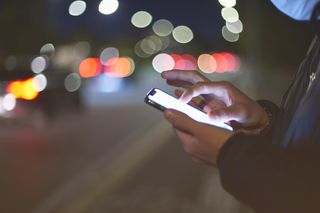 man using mobile phone outdoors