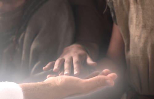 depiction of hand touching Savior’s hand