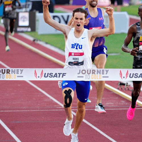 runner crossing finish line