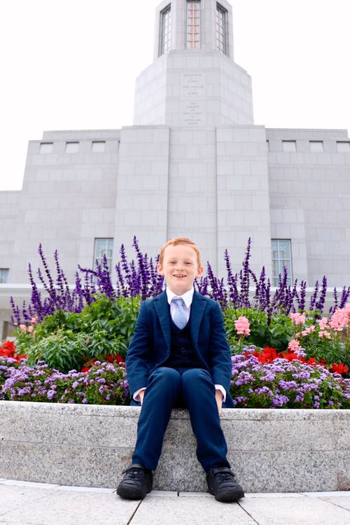 boy standing in front of temple