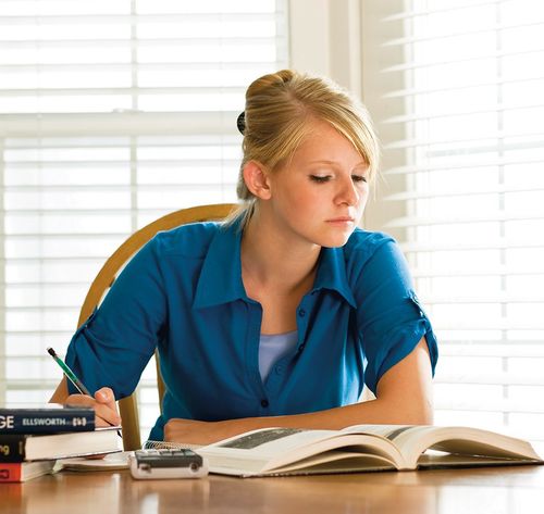 woman studying textbook