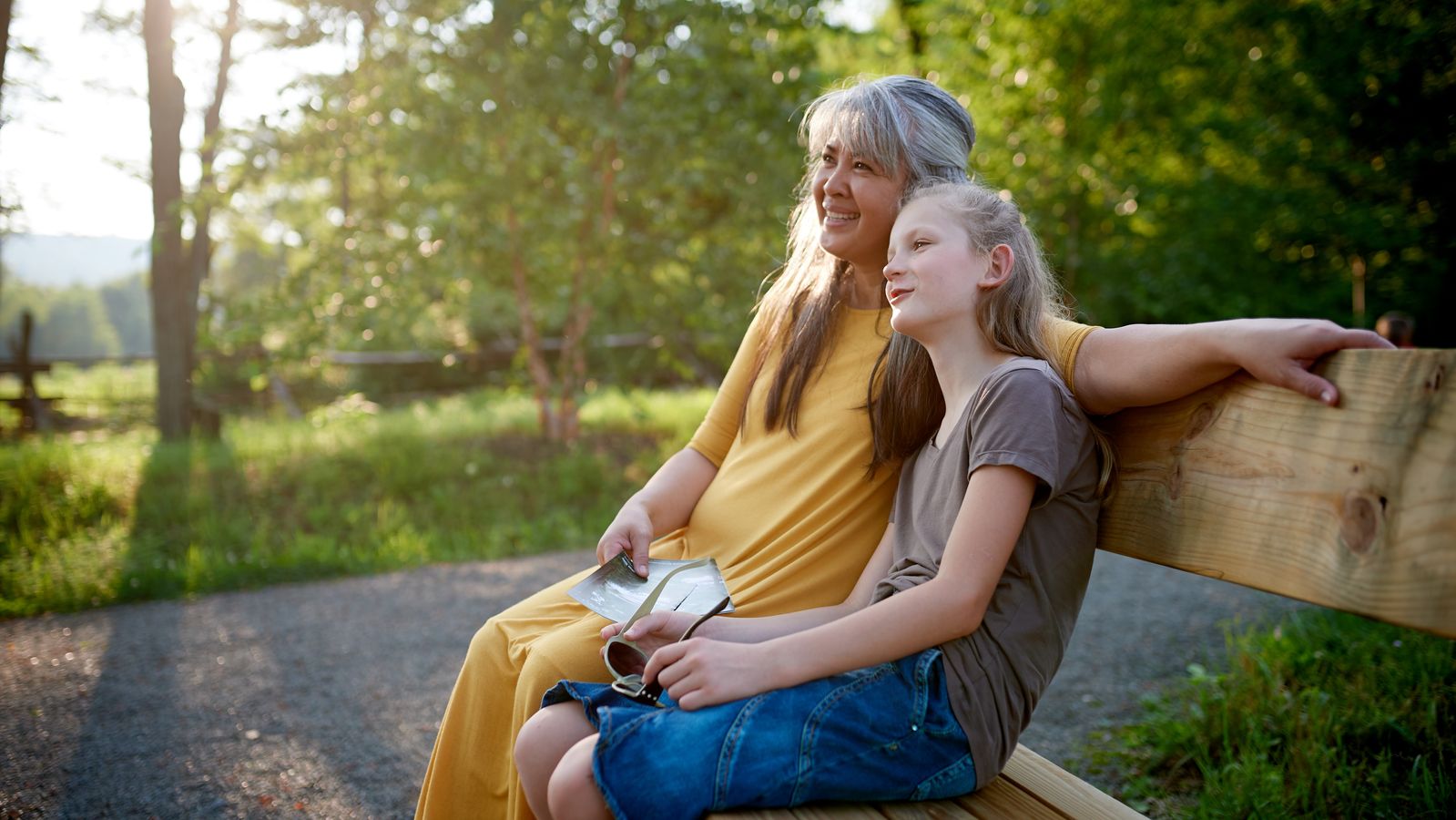 Exterior of woods near the Visitors' Center at the Priesthood Restoration Site near Susquehanna Depot, Pennsylvania.
A mother and daughter sit on a bench off the path.