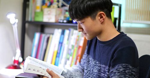 young man reading scriptures