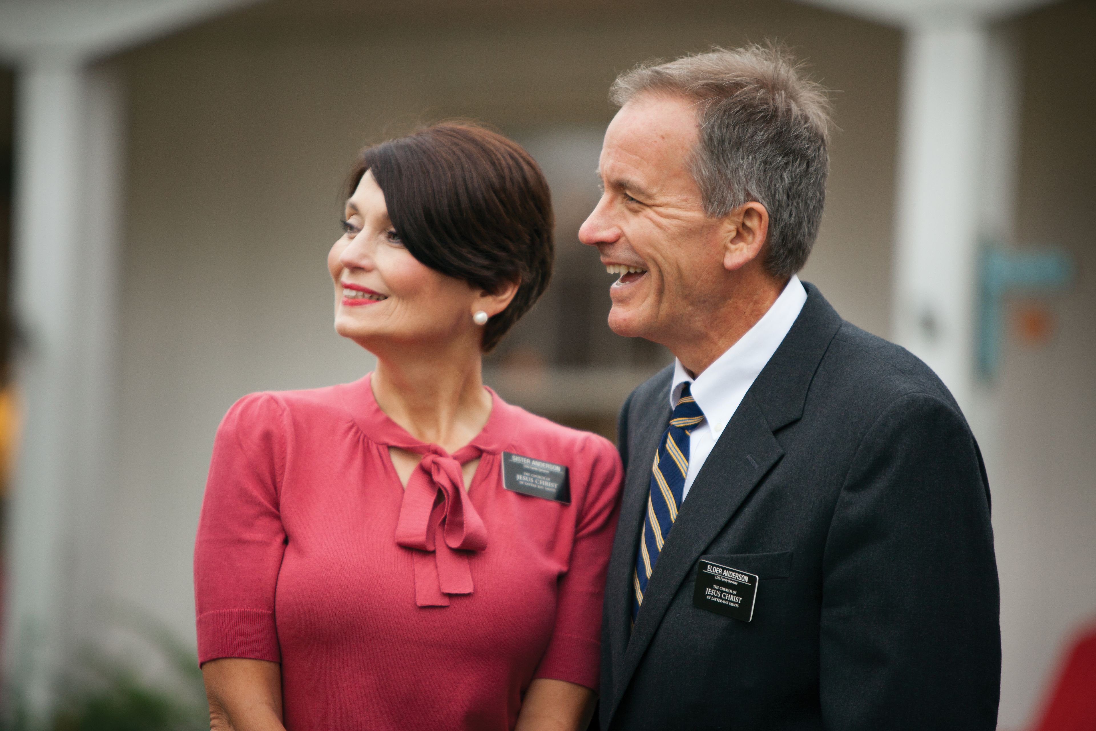A senior missionary couple standing and smiling.