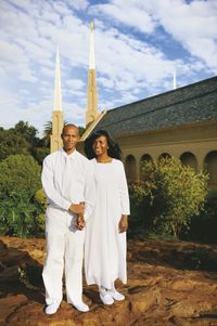 couple in white with temple in background