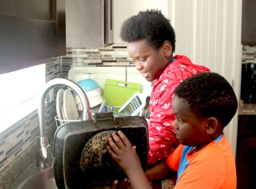 Willard and his brother washing dishes together