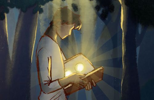 young man looking at an open book, from which light is streaming