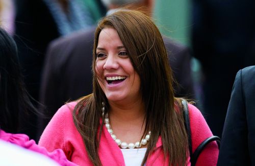 A woman laughing at the April 2011 General Conference.