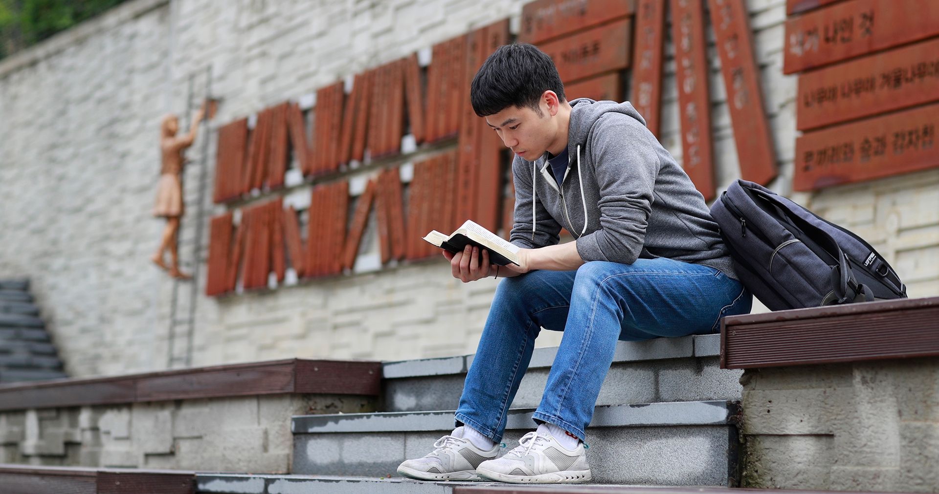 Young man reading a book.