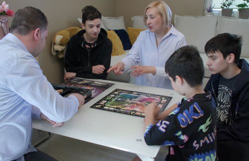 people playing a board game together