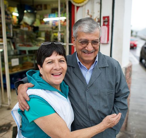 couple standing in front of a store