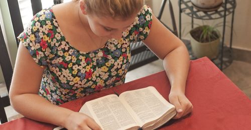 young woman reading scriptures