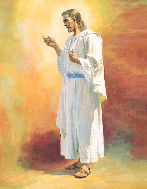 A full standing portrait of Christ in white robes, seen from the side, gesturing to the left in front of a wash of orange and yellow colors.