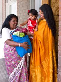 women with bag of groceries