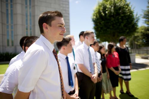 Elder and sister missionaries standing in a line on the grass outside the Cebu City Philippines Temple.