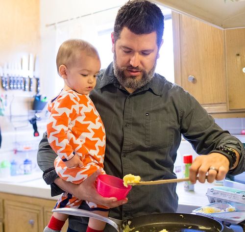 dad cooking scrambled eggs